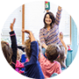 special education teacher raising hand in class