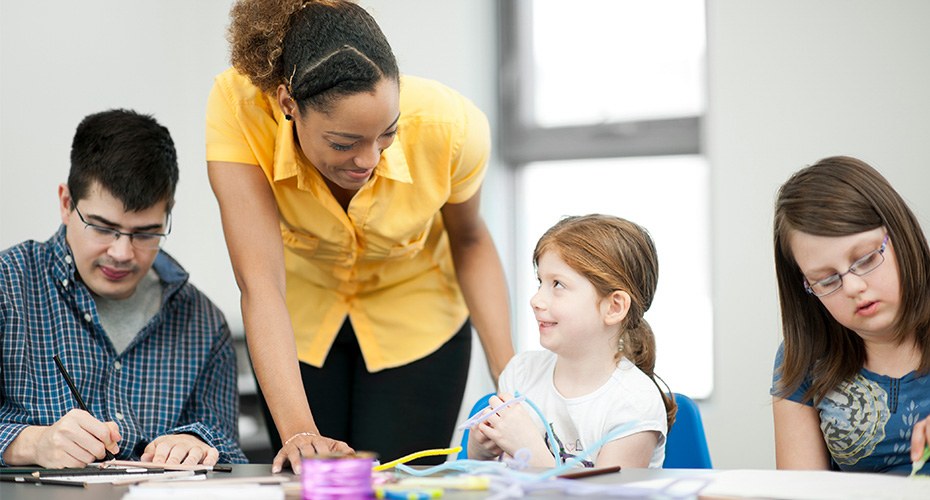 special education teacher with three special needs students