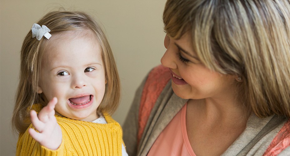 special ed teacher with small special needs child in the public school system