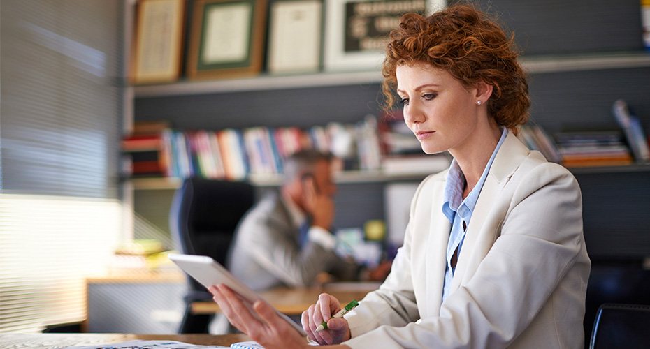 female educational research and policy adviser at work in administrative office