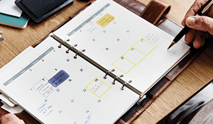 planner with multiple things written in for dates