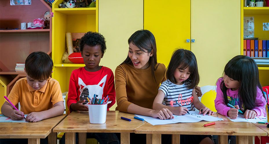 elementary teacher with class who has considered what teaching specialization to pursue