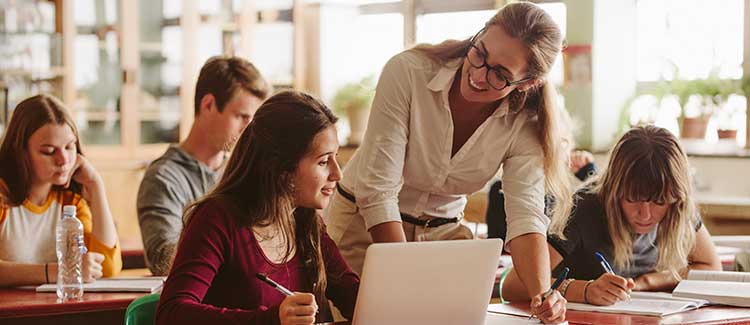 high school teacher in discussion with student