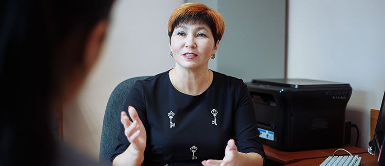 school principal confers with student