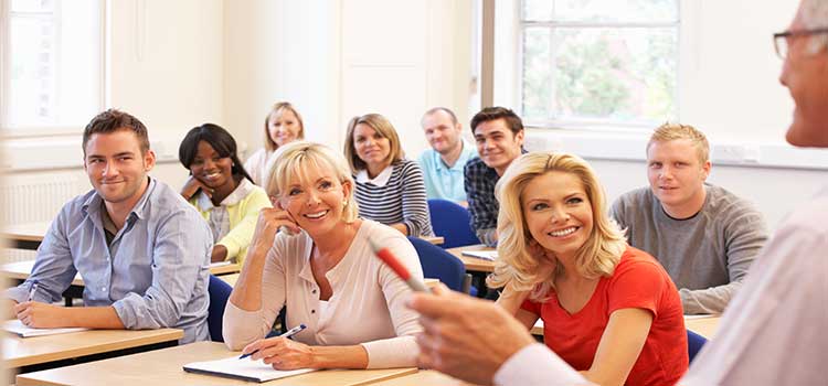 man teaches group of adult learners