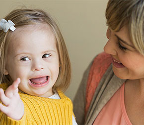 special ed teacher with small special needs child in the public school system
