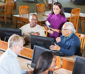 adult education leads classroom at night school