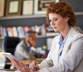 female educational research and policy adviser at work in administrative office