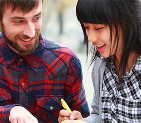 esl teacher working with international students on language skills