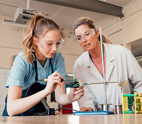 stem teacher and student in science class