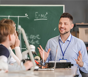 substitute teacher teaches maths to group of school children