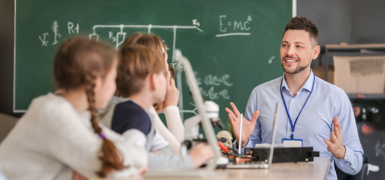 substitute teacher teaches maths to group of school children